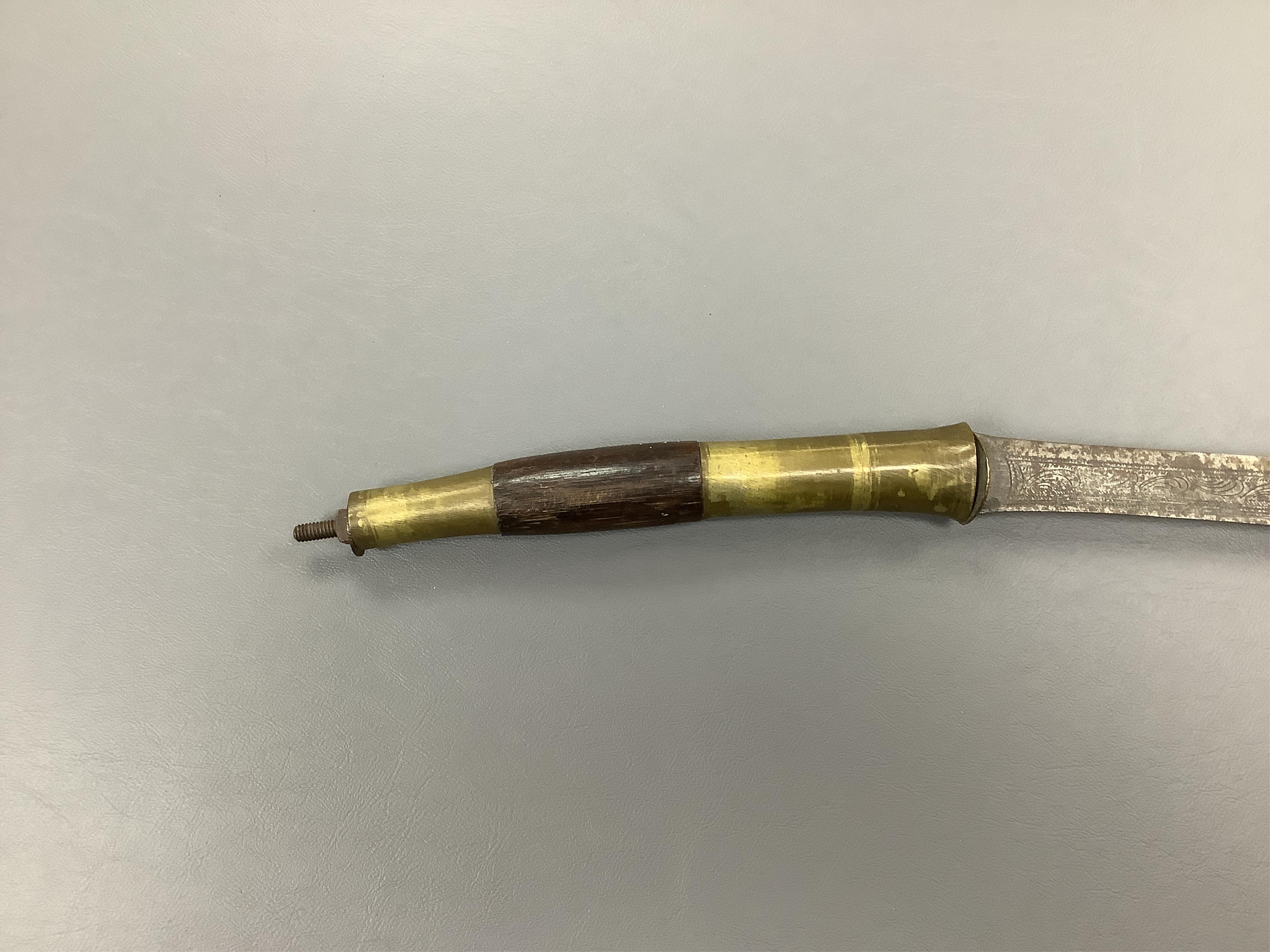 Eighteen assorted world weapons comprising a silver jambya (pommel missing), a knobkerry, a dha, two kris (one with handle missing), a lohar, three kukris, a djambok, a Chinese trousse, a chora, a flyssa, five others and